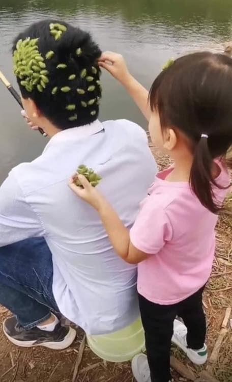 She began placing strange objects on her fathers head. Then suddenly…