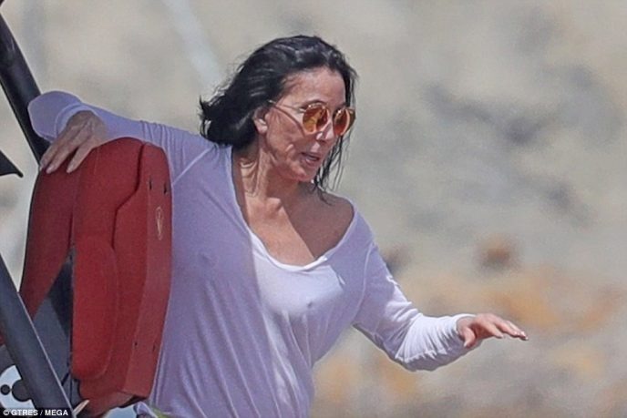 Paparazzi captured Cher, 76, with no makeup and in a wet blouse on vacation